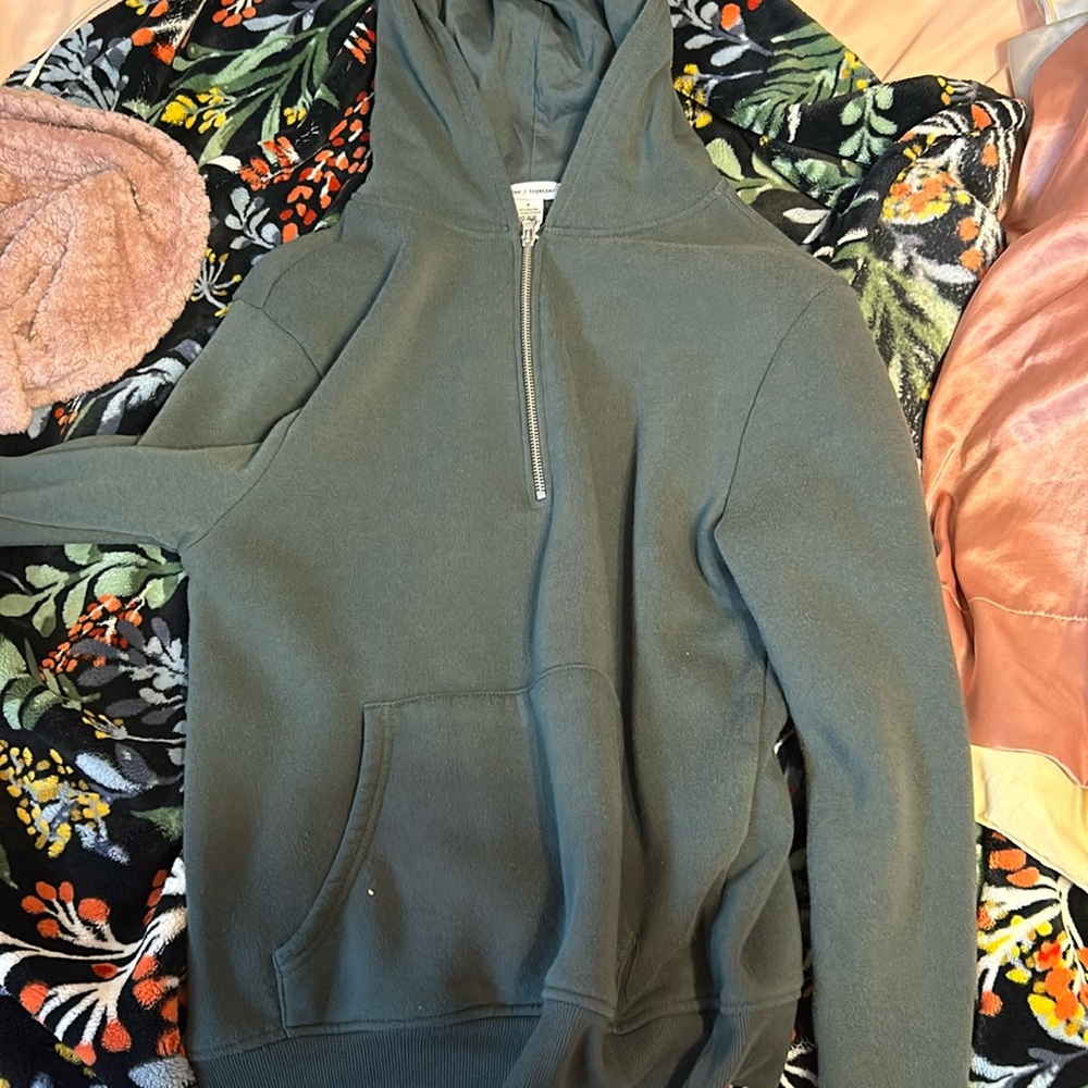 a green hooded half zip  hoodie